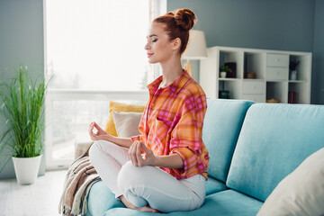 Sticker - Full body portrait of carefree nice lady sit comfy sofa meditate retreat spacious bright apartment inside