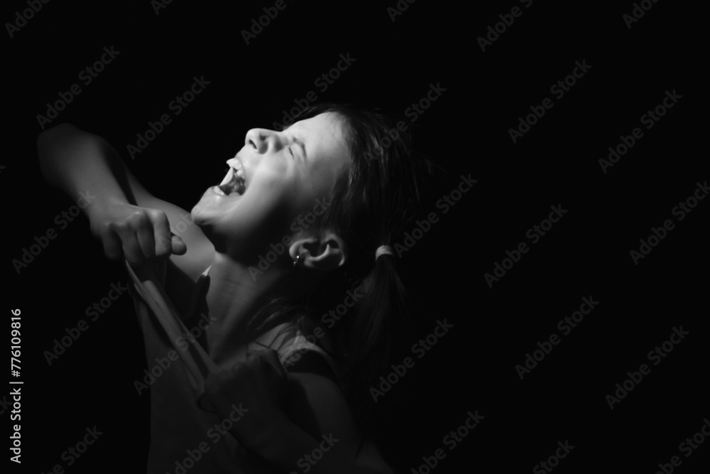 Sad and desperate young girl crying. Lost childhood, emotional pain ...