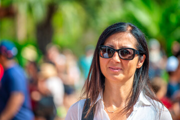 Sticker - A woman walking outdoor on a sunny day