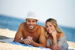 © peopleimages.com - Couple, portrait and relax on sand or vacation, smile and peace at beach or lying by water. People, happy and tropical ocean for bonding on weekend, outdoor nature and love for marriage or romance