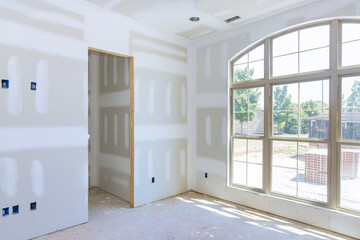 Wall Mural - Gypsum plaster walls are in process of being finished for painting in new home