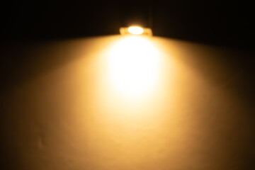Wall Mural - a light is shining on a wall, creating a warm and inviting atmosphere
