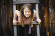Portrait of a funny little girl wearing headphones.