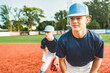 Young teen boy play baseball on a playground