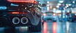 Close up of a car in a showroom, a detail shot of the back end with exhaust pipes and tail lights, a blurred background showing other cars. with copy space fr add text.