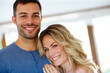 © peopleimages.com - Man, woman and hug in portrait for love, relationship or memories together. Happy, couple and romantic embrace smile for dating, compassion or care in home cheerful for support, commitment and trust