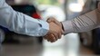 Closeup handshake salespeople to customer after deal the sale of a new car. AI generated