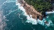 aerial view of the rocks against which the powerful waves of the Indian Ocean break. High quality photo