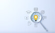 © Supatman - Educational growth and goal achievement concepts. Magnifying glass focuses on a light bulb representing ideas, surrounded by various education symbols. e-Learning, learning online, training course,