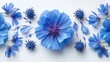   A cluster of blue flowers, arranged together on a white background, features purple centers encircled by smaller blue blossoms