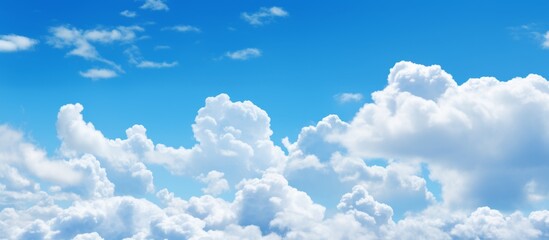 Canvas Print - A commercial aircraft soaring high in a vibrant blue sky dotted with fluffy white clouds