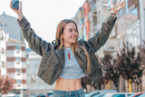 Fototapeta Panele - urban blonde girl on the street excited with joy