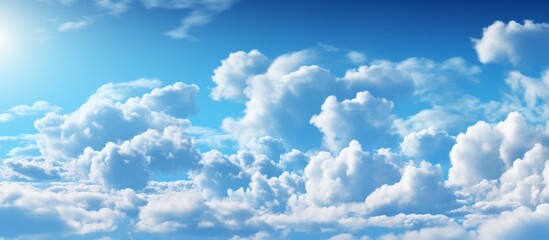 Poster - View of the sky showing puffy clouds and a shining sun in a close-up shot, creating a serene and beautiful scene