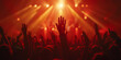 © vanilla_jo - Crowd at a concert with hands raised up in the air.