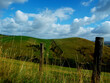 Tranquil Countryside Bliss: Rolling Hills and Rustic Wire Fences in Picturesque Landscape!