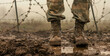 Camouflaged Soldier Standing in Mud