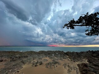 Storm out at sea with boats during sunset, Seventeen Seventy, Queensland, Australia