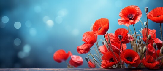 Poster - Numerous vibrant red flowers displayed beautifully on a table surface, creating a striking visual impact