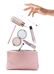 Poster - Woman throwing makeup products into cosmetic bag on white background, closeup