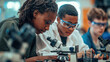 A photo of two students, one African American girl and the other white boy with blonde hair using microscopes in an educational setting.