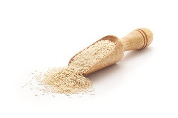 Wall Mural - Front view of a wooden scoop filled with Organic White Sesame seeds (Sesamum indicum) or Til. Isolated on a white background.