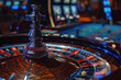 Casino Nights: A Close-up View of a Roulette Wheel Amidst the Gaming Excitement
