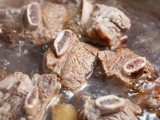 Canvas Print - Beef ribs boiled in a pot	