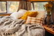 A cozy bedding in a tiny home on wheels with plush pillows and warm blankets creating a snug atmosphere