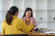 © crizzystudio - Two Young Asian businesswoman discuss with new startup project Idea presentation, analyze planning and financial statistics and investment market at office.
