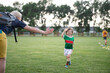 © Vesna - Mom with her son on the soccer field. A parent cares and encourages his child.
