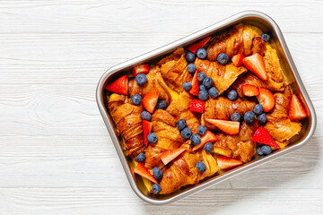 Poster - berry croissant casserole in baking dish, top view