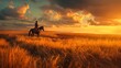 A man on a horse looks into the distance at a beautiful sunset and the setting sun in a field next to his farm