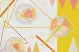 Fototapeta Kwiaty - Photo mixed with graphics (abstraction): summer drinks with grapefruit and lemon, yellow and peach; top view. 
