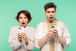Portrait photo of smiling, shocked people holding mobile phones, looking at screen and screaming