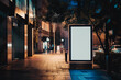 © VisualProduction - Mockup. Blank white vertical advertising banner billboard stand on the sidewalk at night