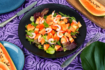 Wall Mural - Fruit salad with shrimp and exotic papaya.