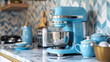 Modern blue kitchen appliances on marble countertop