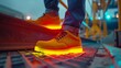 Safety shoes that change color based on environmental risks, offering a visual safety awareness system for construction sites