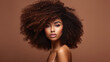© ribelco - Beautiful black woman . Beauty portrait of african american woman with clean healthy skin on beige background. Smiling beautiful afro girl.Curly black hair