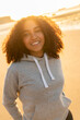 African American Girl Teenager Smiling on a Beach at Sunset