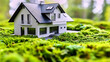 Miniature model home surrounded by lush greenery