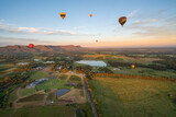 Fototapeta  - Hot air balloons in Pokolbin wine region, aerial landscape at sunrise, Pokolbin, Hunter Valley, NSW, Australia	