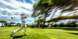 Fototapeta Kosmos - A golfer swinging his club at a golf club in motion