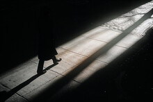 Lone Figure, Long Shadow, Stark Contrast, Urban Solitude, Sunset.
