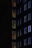 Fototapeta Morze - ARCHITECTURE - Building at night with light in the windows