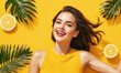 Happy smiling excited young beautiful woman on summer yellow background with oranges and tropical plants