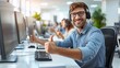 © Ilja - Positive male customer service agent giving thumbs up in modern call center with bright lighting