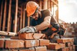 © pawimon - Engineer Man bricklayer installing bricks on construction site Building construction site collaboration concept copy space for text and design
