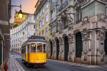 Poster - Yellow tram on a street with historic buildings in Lisbon, Portugal