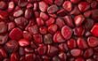 A captivating collection of polished and natural red jasper stones in various shades, shapes, and sizes, creating an alluring and vibrant visual tapestry.